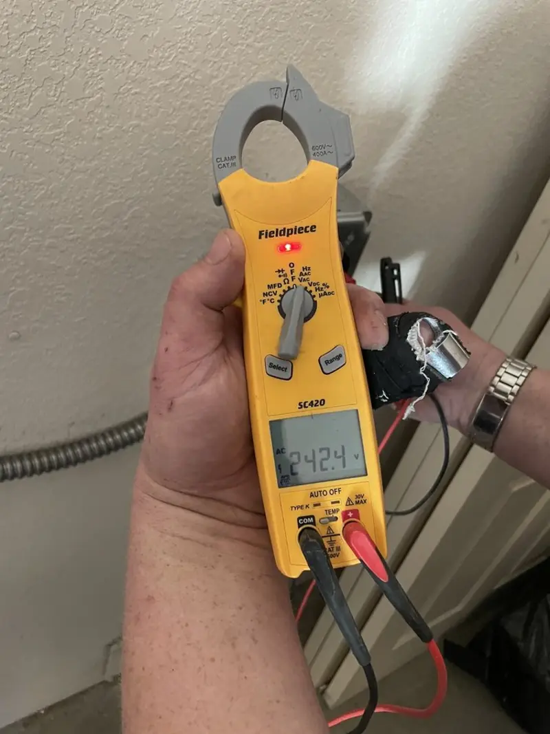 Voltage testing with clamp meter during Generator Installation in Maple Heights-Lake Desire